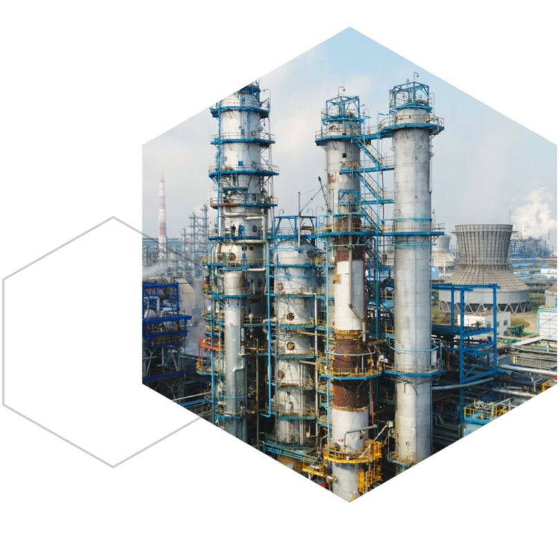Industrial oil and gas refinery with distillation towers and cooling infrastructure