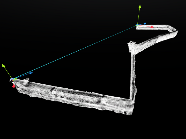 3D scan-based mesh of a rock wall segment displayed in Prevu3D against a black background with axis orientation.