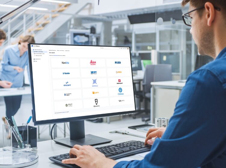 Engineer using Prevu3D platform on desktop computer in modern office