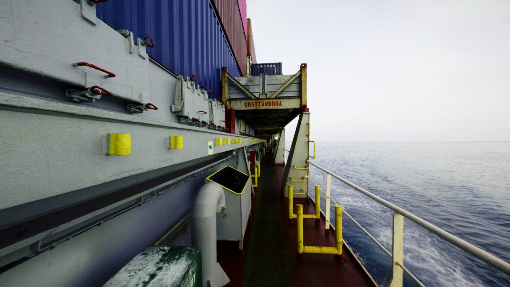 Panoramic view of the MV Chattanooga’s port-side walkway, showing safety railings, equipment, and access areas along the vessel exterior.