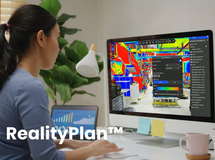 Engineer using Prevu3D RealityPlan™ clash detection tool on desktop to visualize and analyze mechanical assets in a 3D scan environment.