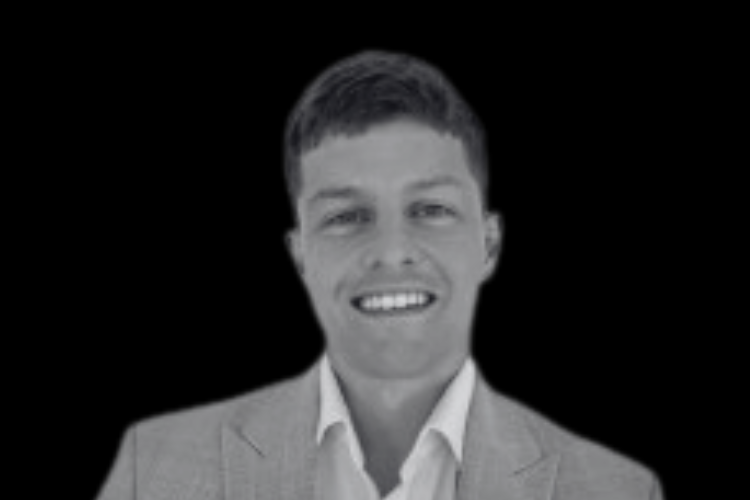 Sam Lee – Managing Director at Ataris Headshot - Prevu3D Black-and-white headshot of Sam Lee, Managing Director at Ataris, smiling and facing the camera against a dark background.