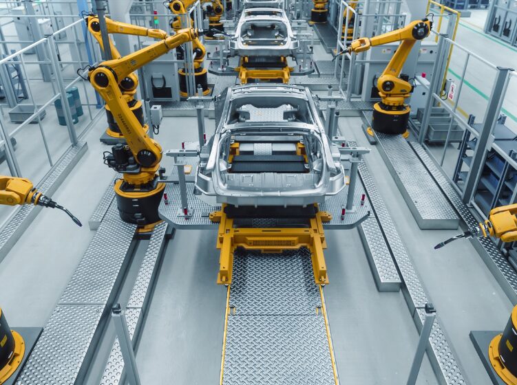 Automotive manufacturing line visualized through digital twin data overlays