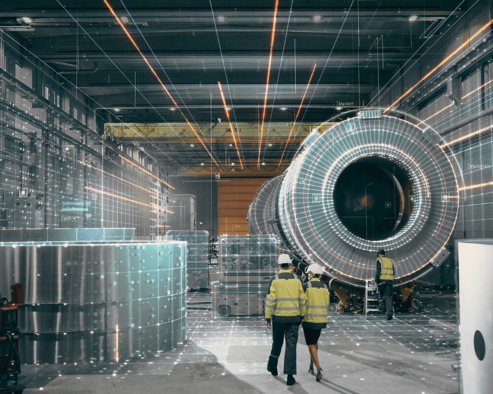 Industrial Factory Scene with a Large Cylindrical Machine and Three Workers in High visibility Vests Inspecting It Prevu3d